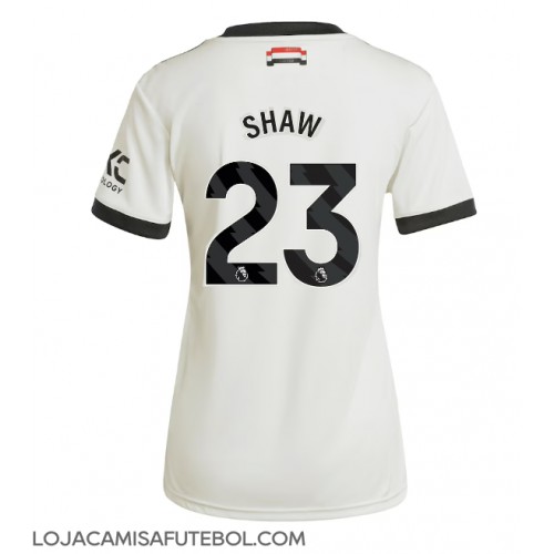 Camisa de Futebol Manchester United Luke Shaw #23 Equipamento Alternativo Mulheres 2024-25 Manga Curta